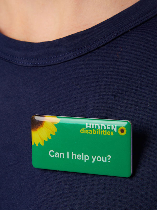 Can I help you? (staff badge)