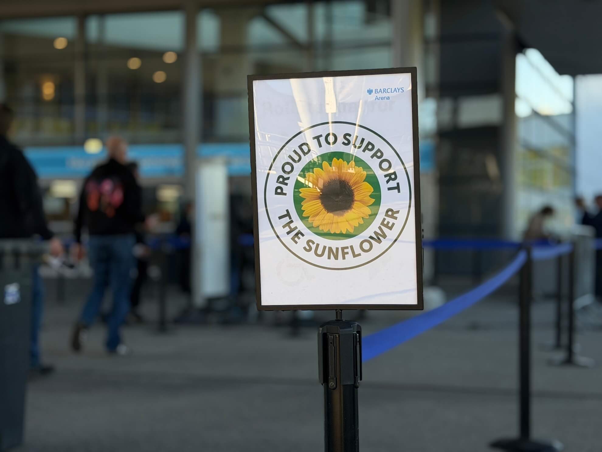 Sunflower sign in a circle in entrance of concert arena