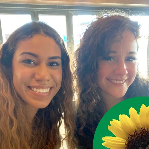 Karina Smith, a brown skinned lady with long light brown curly hair and Michelle Culbert, a white lady with long brown curyly hair