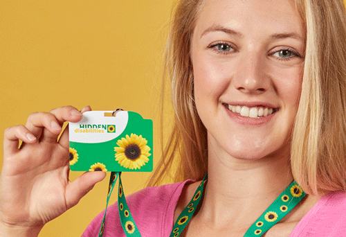 Blond woman holding a sunflower card