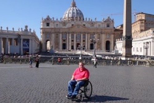 Fred Maahs in St Peter's Square, Vatican City. The Basilica of St Peter is in the background. 