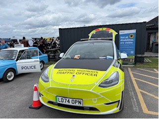 National Highways Traffic Officer vehicle parked next to a sign that reads 'Not all disabilities are visible' with the Sunflower symbol