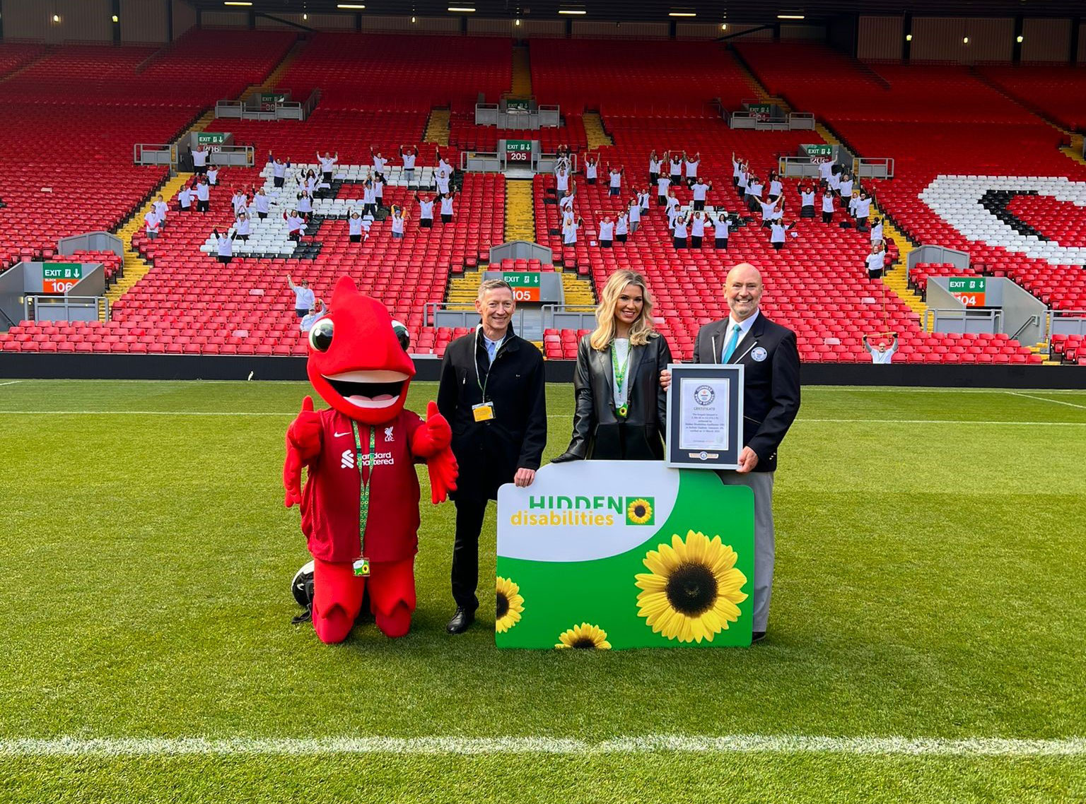 Paul White, Christine McGuinness, the Mighty Red and Glenn Pollard at Anfiled in fromn the Kop