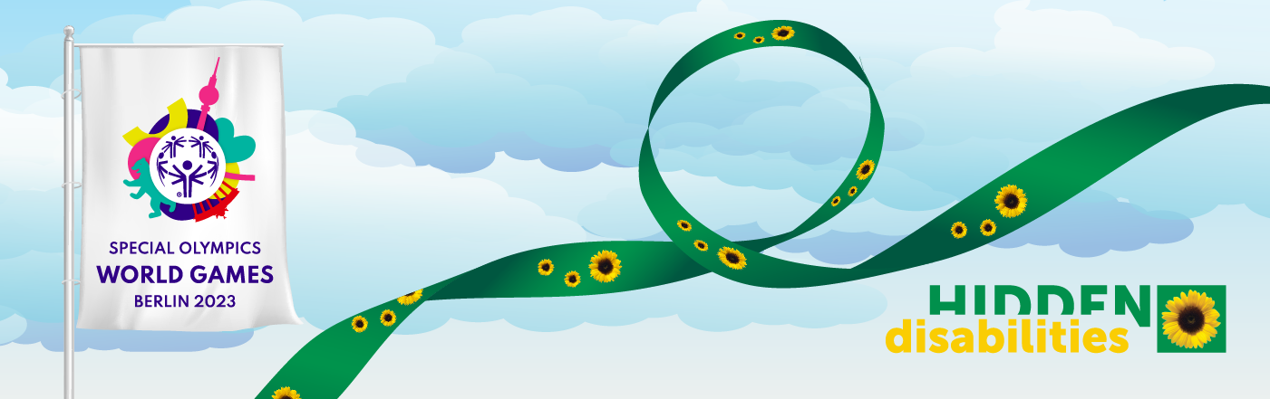 Special Olympics World Games logo in a flag against a blue sky with clouds and a green lanyard with yellow sunflowers