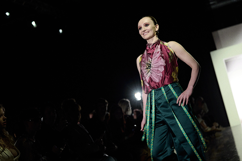 The festival cape made from part of the world-record Hidden Disabilities Sunflower lanyard on the runway at Manchester Fashion Week.